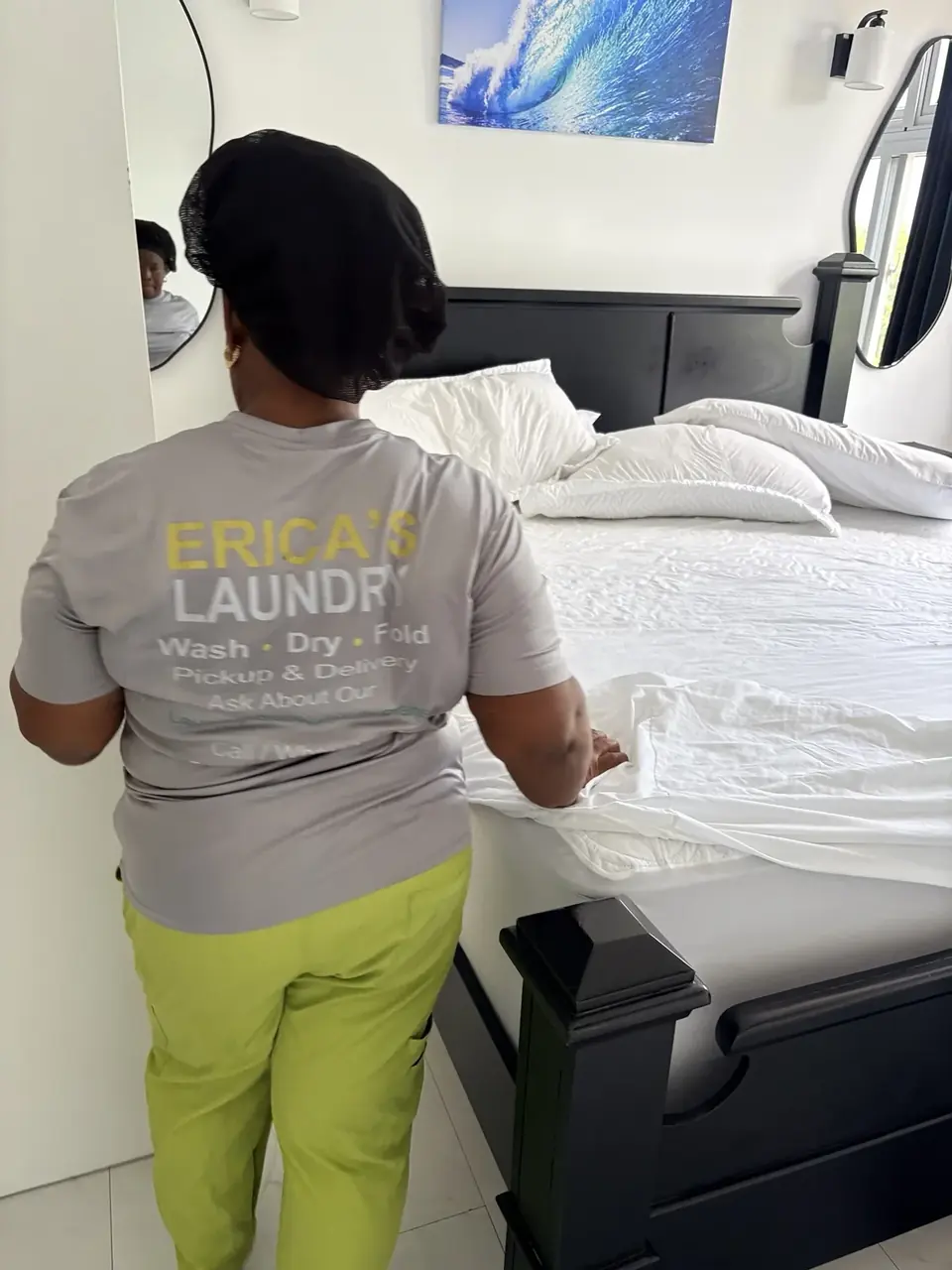 ELCS team member preparing fresh bed linen during a property care visit